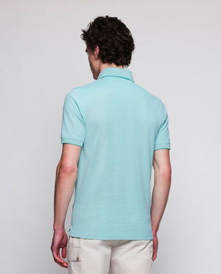 Green piqué polo in tone rivet